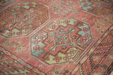 Geometric Ersari gul with even wear in dusty raspberry and sky blue.