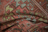 Distressed antique Ersari rug pile detail, featuring faded raspberry, jade green, and time-softened blue guls.