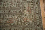 Calligraphic script within signature cartouche borders of a fine antique Persian Tabriz carpet.