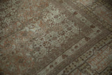 Detail of the cartouche border and mostly even patina across the knot heads of a Tabriz carpet.