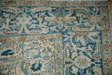 Detail of the low, even pile on a Heriz corner with blue and beige Samovar designs.