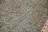 Distressed Indian Ahar carpet, Souf weaving with three-dimensional texture and muted blue, brown floral patterns.