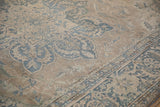 Distressed Indian Ahar design carpet showing Souf weave texture and floral patterns in blue and beige.