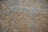 Three-dimensional Souf weave texture with dusty blue and pale coffee floral tendrils.