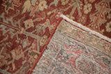 Distressed burgundy, beige pile texture revealing hand-knotted foundation of vintage Heriz rug.