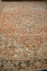 Vintage Heriz carpet detail, geometric floral motifs with heavy abrashes, terracotta and charcoal.