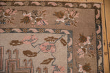 Distressed Turkish Kars rug corner, coffee brown and dusty mauve floral border with even wear.
