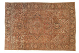 Distressed vintage Heriz carpet with concentric medallions, faded rust, chocolate, charcoal tones, 7'6