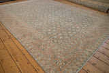 Angled corner view of a vintage Tabriz carpet highlighting its Samovar Turtle border in pale terracotta.