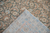 Back of the vintage Tabriz rug showing its hand-knotted foundation and bound edge.