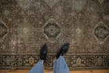 Close view of the fine Heriz carpet's low pile, showing Karaja stylized medallions and even wear.
