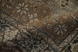 A soft fold reveals the even, low-pile texture of this fine hand-knotted Heriz carpet.