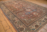 Vintage Mahal carpet section with dusty rose field, blue lotus flowers, and floral palmette border.