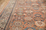 Vintage Mahal carpet's dusty rose field, blue floral palmettes, and ivory patterned border.