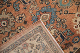 Vintage Mahal carpet detail: faded floral Darus motif, worn pile, and visible side selvage.