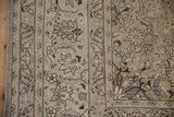 Vintage Tabriz border with artificial silk inlay highlights and a softly distressed pile.