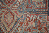 Hand-knotted Samovar Turtle design in sapphire blue and cherry red showing the carpet's low, even pile.