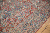 Close view of the reciprocating Samovar Turtle border on a distressed vintage Heriz carpet.