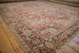 Distressed Heriz carpet corner with geometric field and Turtle Samovar border motif.