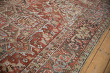Worn Heriz carpet section with geometric blossoms and red, charcoal Turtle Samovar border.