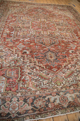 Distressed Heriz rug border with Turtle Samovar motif in rust, charcoal, and ivory.