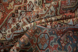 Vintage Distressed Heriz rug pile with red rust, slate blue, and warm ivory tones.