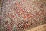 Detail of distressed Heriz carpet showing red rust field and Turtle Samovar border.