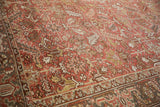 Distressed vintage Mehrivan carpet field with geometric floral blossoms and faint wear.