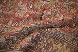 Distressed Mehrivan carpet: worn dusty red geometric floral field and Samovar Turtle border.