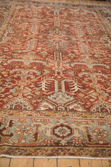 Angled close-up of distressed Mehrivan carpet with germinating boteh field and Turtle Samovar border.