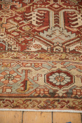 Vintage Mehrivan rug detail showing softened brick red boteh and silver Turtle Samovar border.