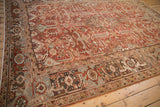 Turtle Samovar border motif on distressed Mehrivan carpet corner, dusty red field.