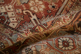 Distressed Mehrivan rug showcasing geometric vines, serrated leaves, Turtle Samovar border, and abrashes.