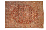 Vintage distressed Ahar carpet with a starburst medallion and curvilinear vines in cherry red, silver, and gold.