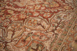 Distressed, low pile texture showing cherry red and ivory curvilinear floral details.