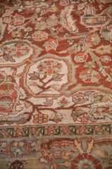 Angled view of the vintage Ahar carpet's hand-knotted pile and curvilinear floral pattern.
