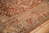 Evenly worn pile and intricate curvilinear patterns on a vintage distressed Ahar carpet.