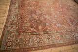 Close-up of distressed Heriz carpet border with Samovar Turtle motif in faded red and blue.