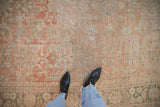 Worn pile with exposed foundation on an antique Mahal carpet with soft floral details.