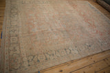 Angled view of an antique Mahal rug highlights its soft, tone-on-tone palette and heavy abrashes.
