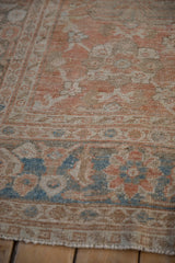 Worn low-pile texture of an antique Mahal rug's border with powder blue and melon florals.