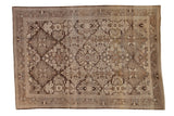Distressed Persian Bibikabad carpet with a floral lattice pattern in rich chocolate brown and pale ivory.