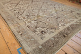 Angled view of a vintage Bibikabad carpet's even, low-pile texture and intricate floral trellis pattern.