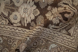 Evenly worn, hand-knotted pile of a vintage Bibikabad rug with chocolate brown and platinum floral details.