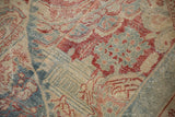 Evenly worn pile on a vintage Mahal carpet revealing knot heads and faded jewel-tone colors.
