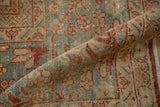 Evenly worn, hand-knotted pile of a vintage Mahal in dusty blue and cinnabar red.