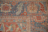 Detailed Karaja style border showing serrated leaves and the rug's even, low-pile wear.