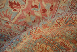 Softly worn pile on a vintage Heriz rug showing the Karaja border in cinnabar red and powder blue.