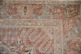 Evenly distressed texture on the Safavid-inspired border with dusty sky blue and faded aubergine tones.