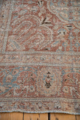 Close view of the worn pile and knot heads within the Safavid-inspired border of a Tabriz carpet.